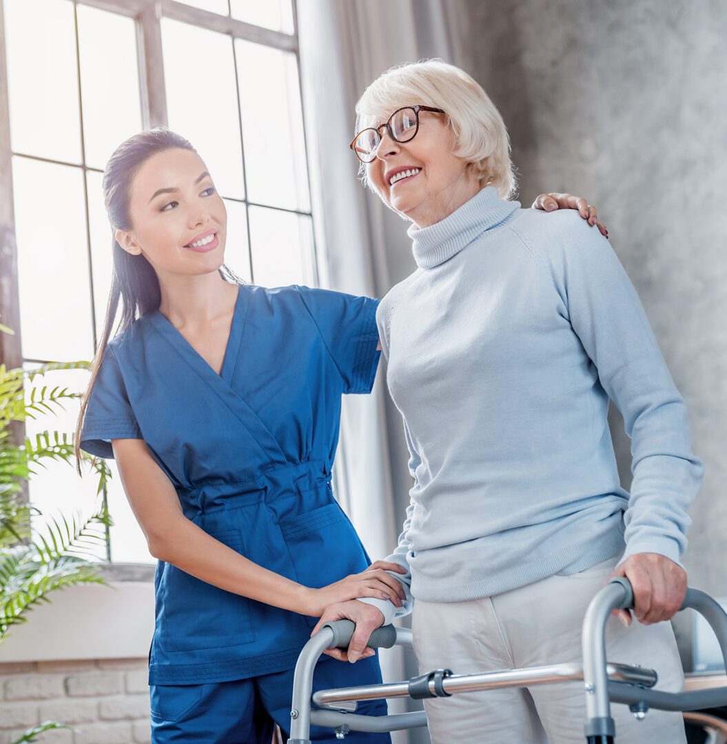 Healthcare worker helping elderly patient